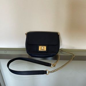 Navy Juicy Couture Crossbody bag with gold hardware.